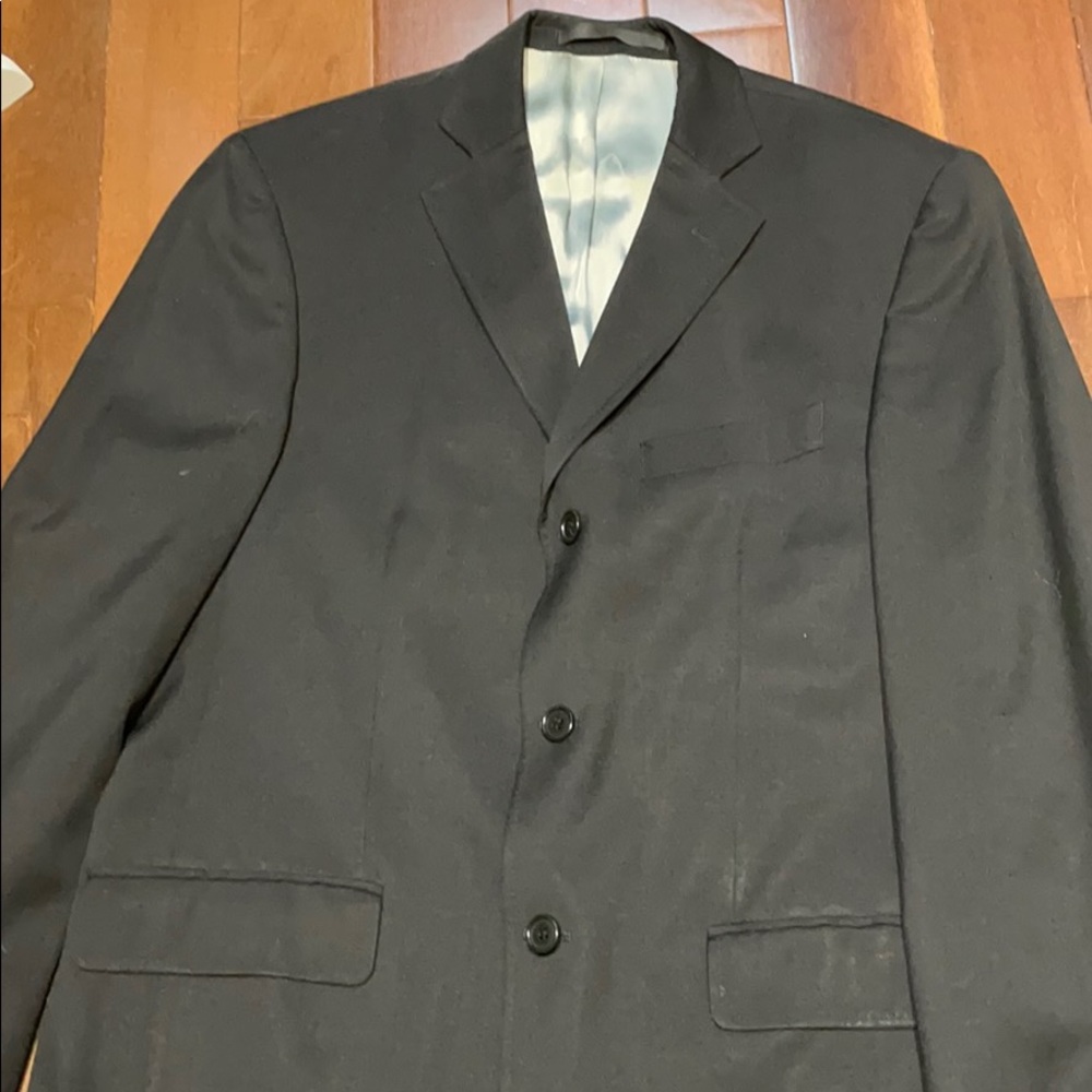 Black 3-button single breasted suit.